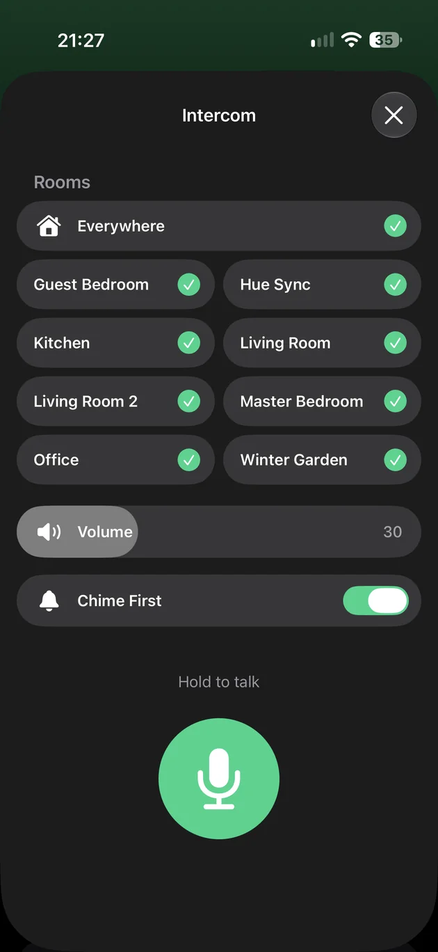 Intercom on iPhone: rooms ticked, a volume, Chime First, and a microphone to hold.