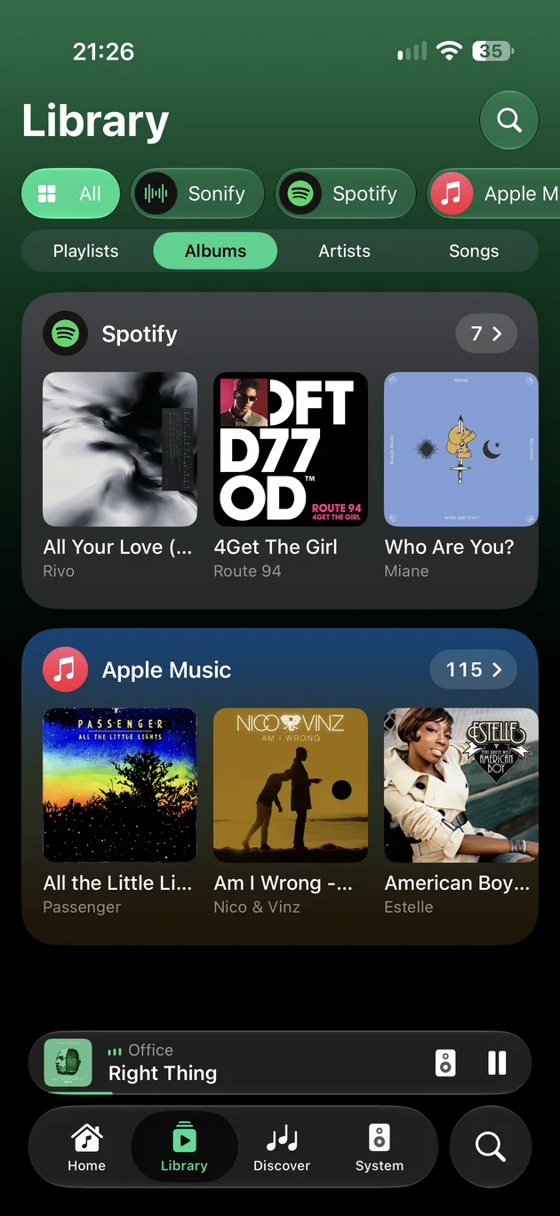 The Library on iPhone, filtered to albums, with a shelf for each service.