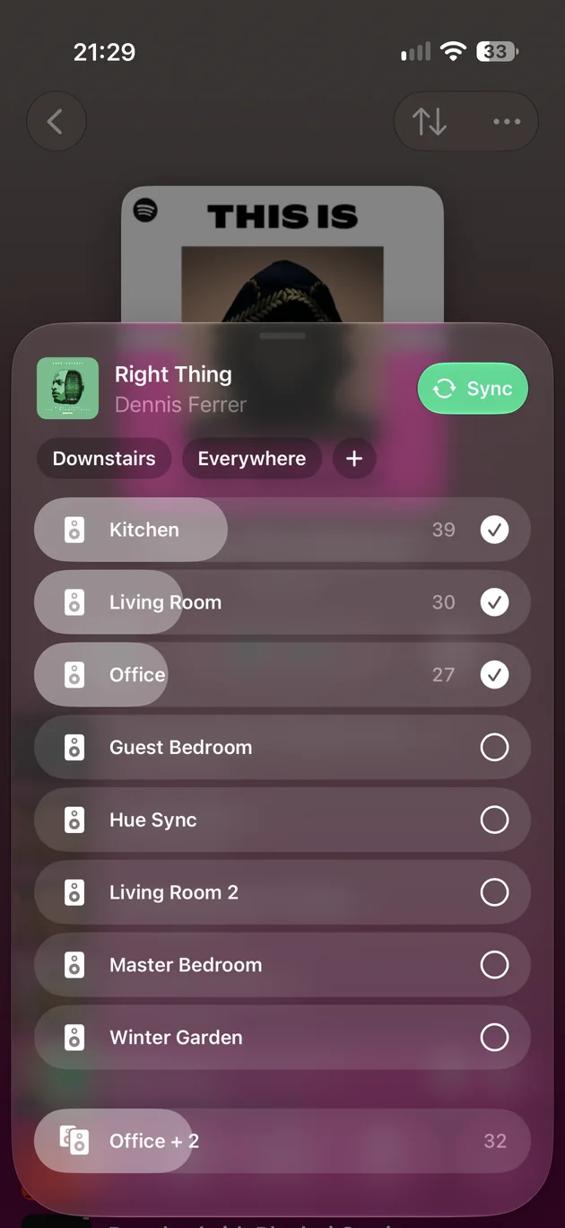 The rooms sheet on iPhone: Downstairs and Everywhere area chips, and a row for each room with its volume and a tick.